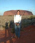 Caro in front of Ayers Rock - the sun is coming down behind us (see the shadow of Seb while he's taking the picture)